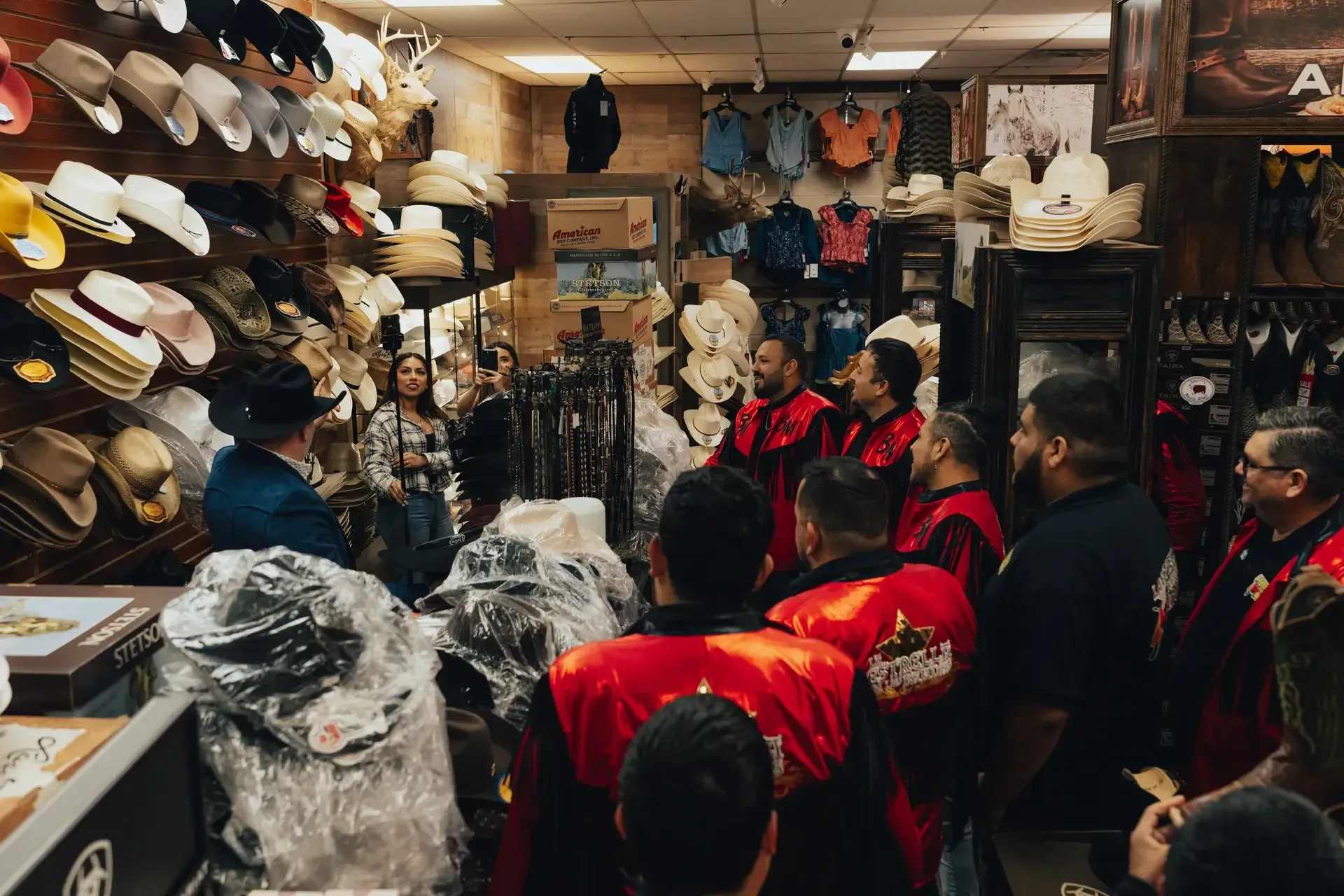 Customers shopping for hats at El Alazán