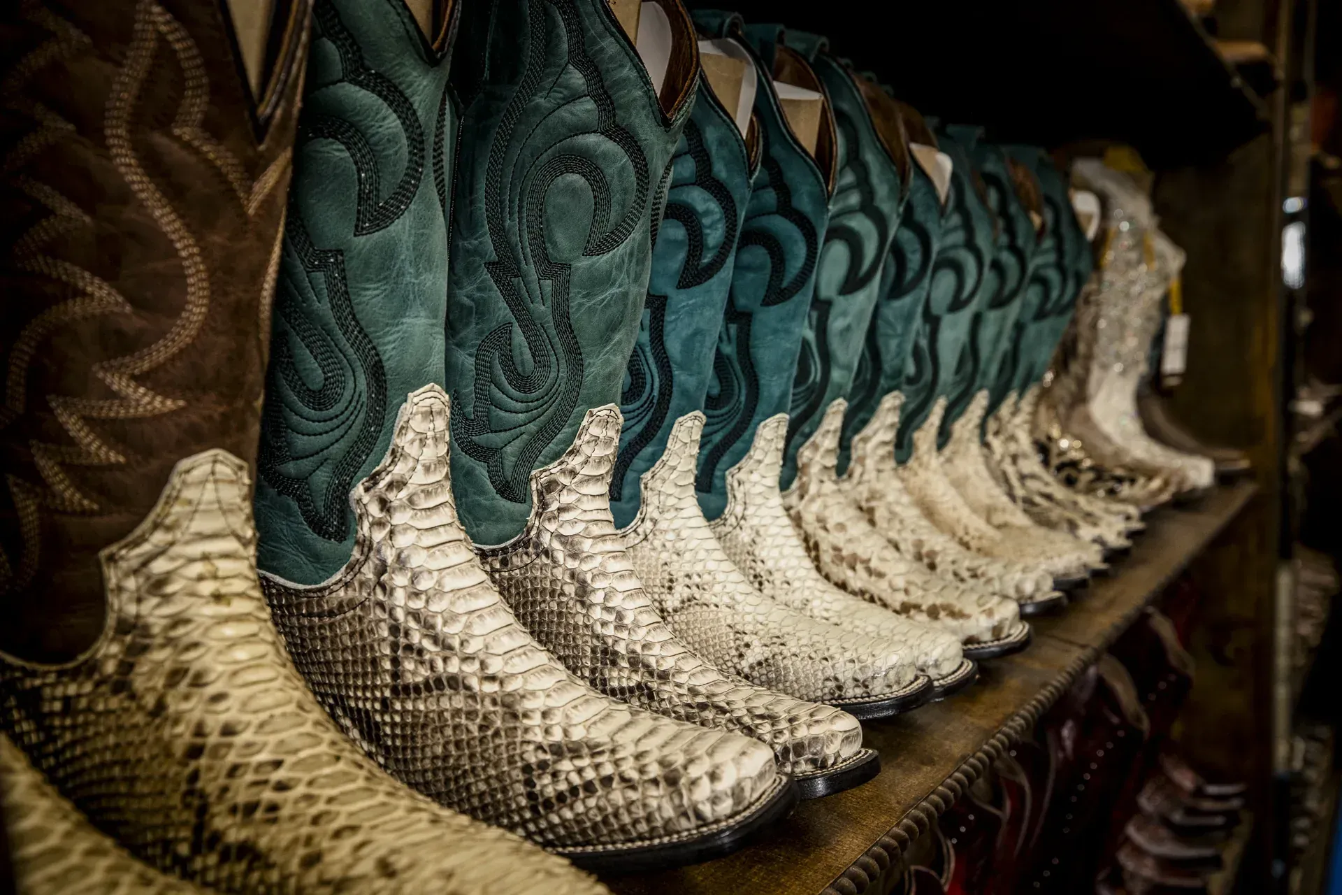 Wall of exotic python cowboy boots at El Alazán