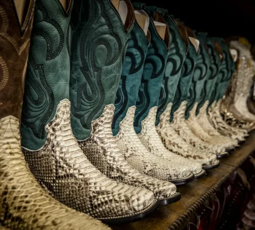 Wall of python and exotic leather cowboy boots at El Alazán
