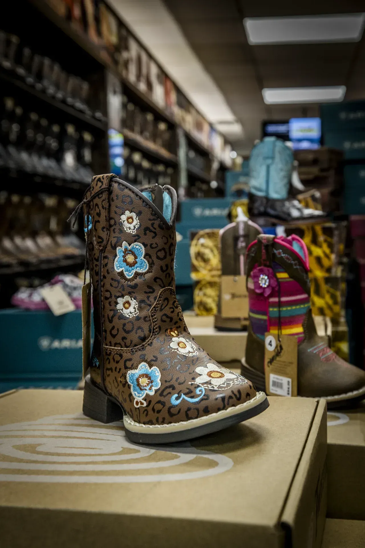 Embroidered kids' western boot on display